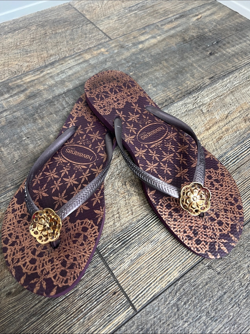 Havaianas Purple Flip Flops with Gold Medallion